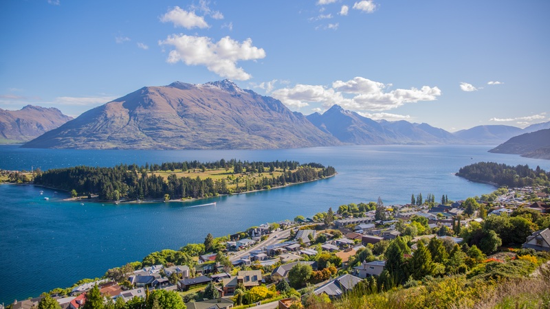 Aerial view of Queenstown on the shore of Lake Wakatipu, surrounded by mountains